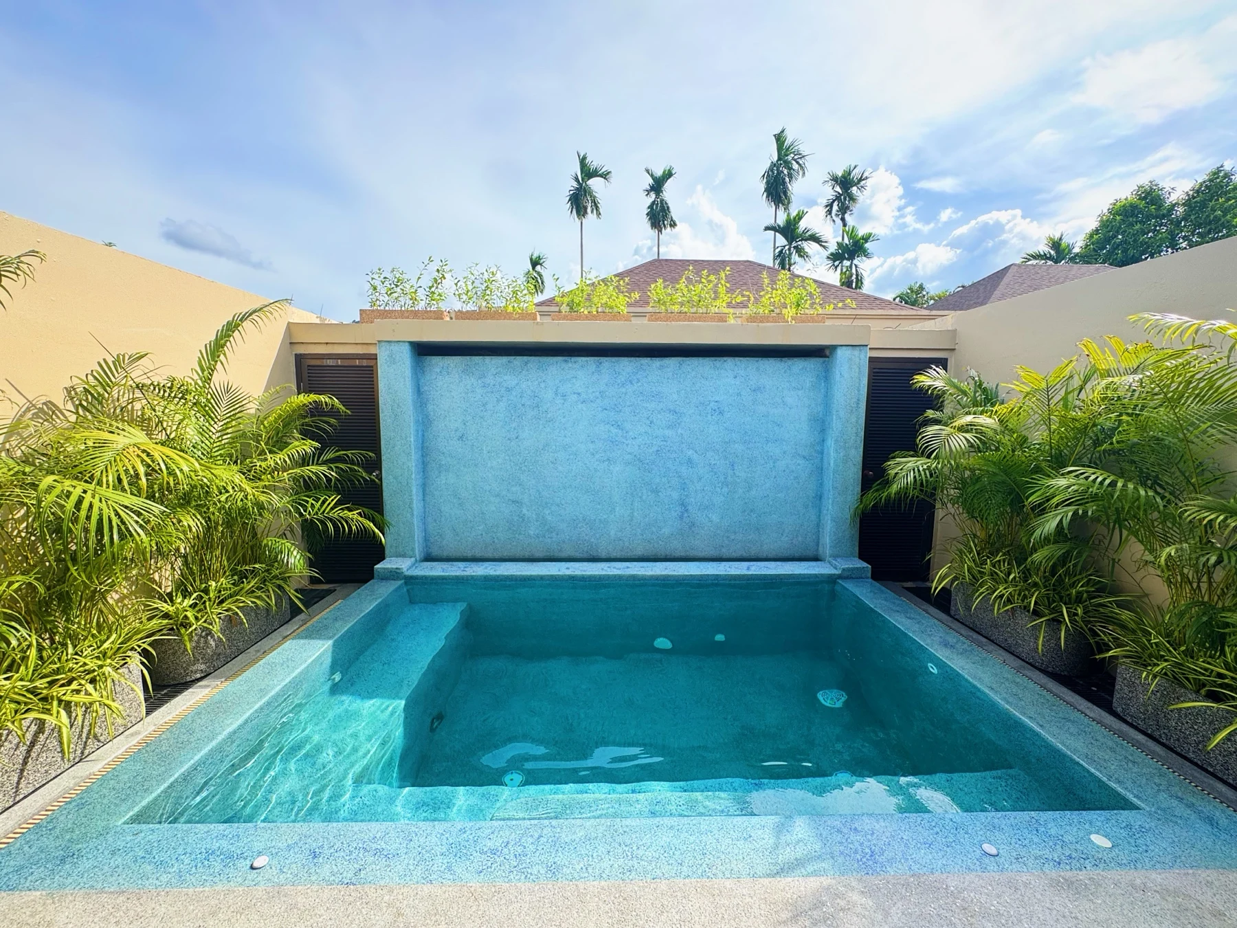 Private Residence, Bang Tao — the plunge pool under its waterfall wall