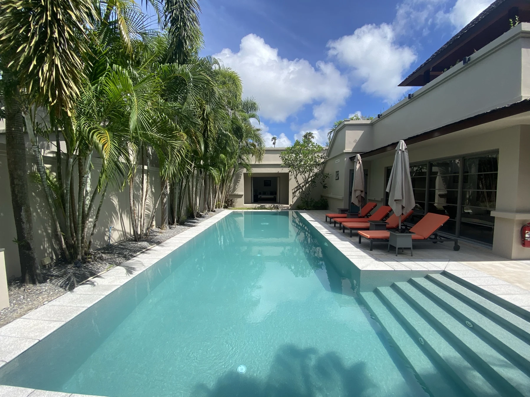 Private Residence, Bang Tao — the long pool and its sun loungers