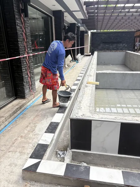 Andakira, Patong — working along the pool edge
