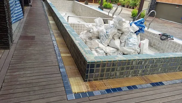 Andakira, Patong — demolition waste in the empty pool