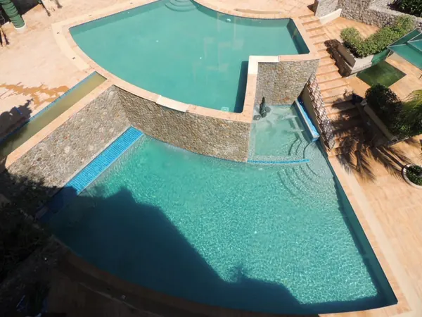 Aspasia Kata — the lower pool below the stone wall