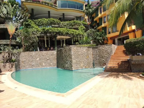 Aspasia Kata — the lower pool and the waterfall wall