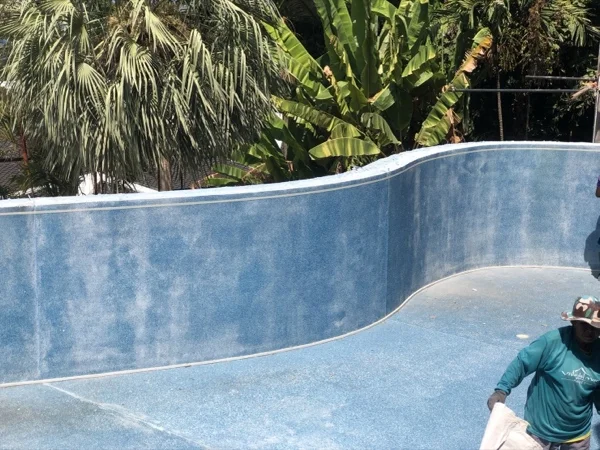 The pool edge cut back along its whole curve, ready for the new surround