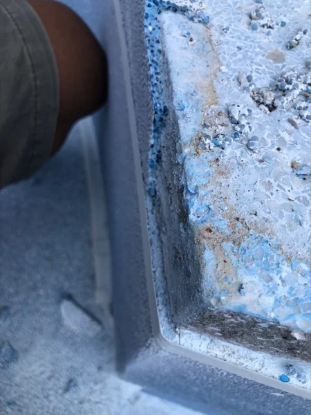The old surround at close range: the aggregate had come away and left the surface pitted with craters
