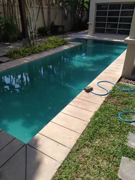 Private Residence, Bang Tao — the pool filled, beside the lawn