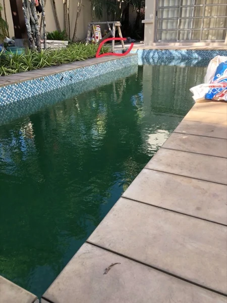 Private Residence, Bang Tao — the old pool, green water over the mosaic