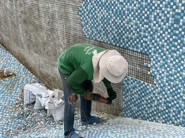 Private Residence, Bang Tao — chipping the old mosaic off the wall