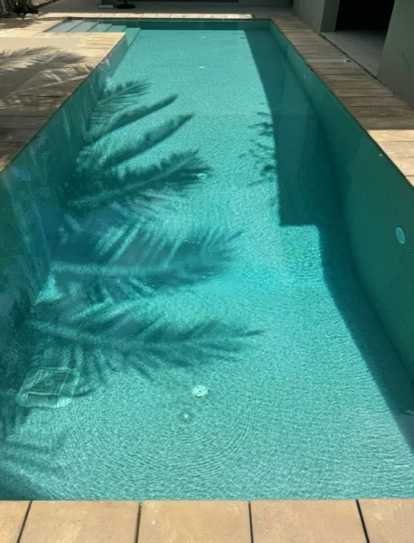 Private Residence, Bang Tao — palm shadows across the new finish