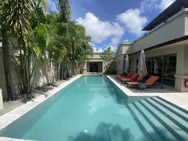 Private Residence, Bang Tao — the long pool and its sun loungers