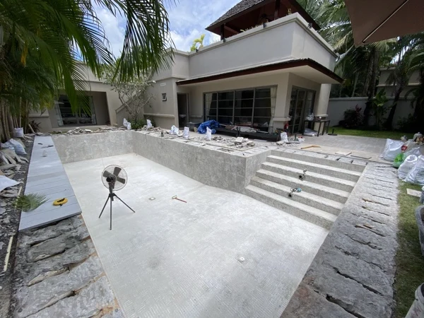 Private Residence, Bang Tao — the pool drained and stripped, new coping being laid