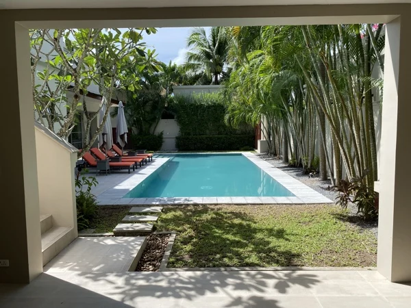Private Residence, Bang Tao — the pool framed by the garden doorway