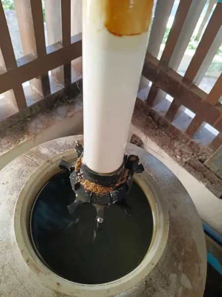 Beachfront Villa, Laguna — the filter standpipe, with dark water left in the tank