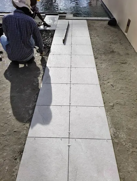Beachfront Villa, Laguna — laying the new large-format tiles