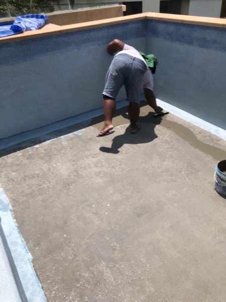 Private Residence, Chom Tawan — applying the finish along the pool wall