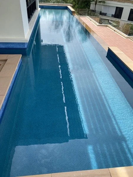 Private Residence, Chom Tawan — the glass panel set into the pool wall