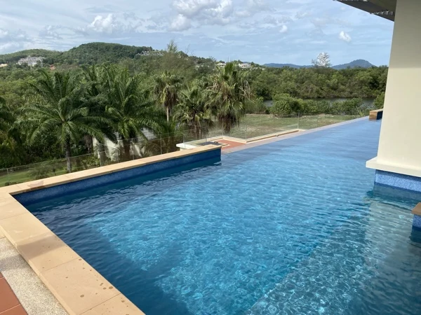 Private Residence, Chom Tawan — the pool over the palms and the hills