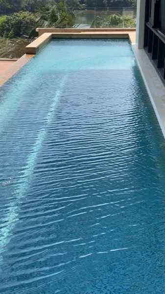 Private Residence, Chom Tawan — the long pool seen from above