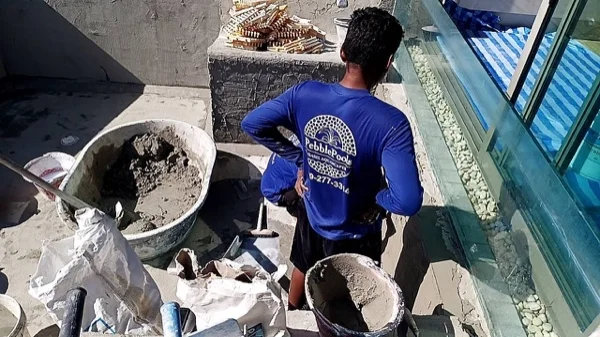 Crest Resort & Pool Villas — mixing the plaster on site