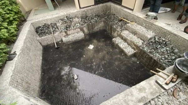 Dewa Resort pool villas — the pool shell after the old surface was removed