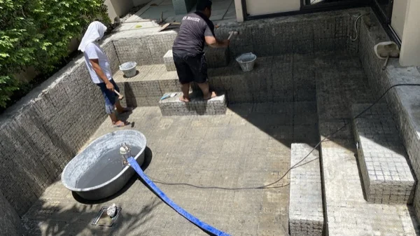Dewa Resort pool villas — applying the finish to the pool walls and steps