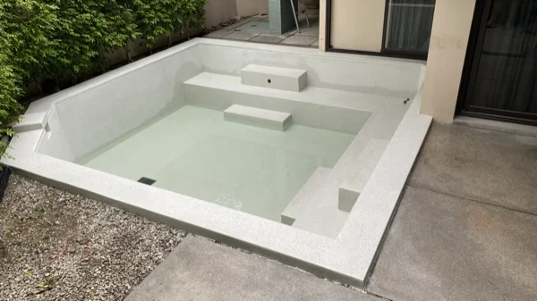 Dewa Resort pool villas — the finished pool, ready to be filled