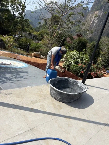 Washing the finished logo down before the walkway was handed over
