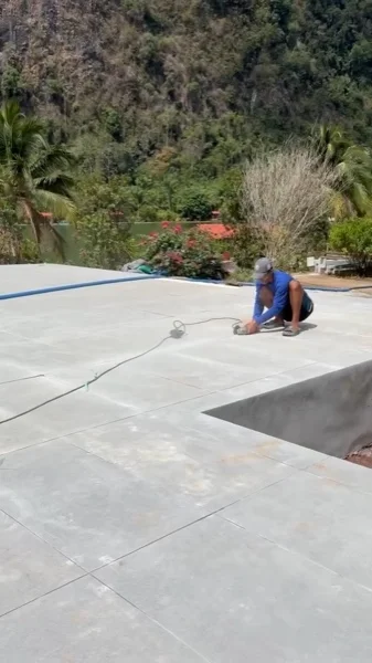 The finished terrace tiling around the pool, with the cut-out left for the jacuzzi: the terrace was tiled by our own crew alongside the pool finish