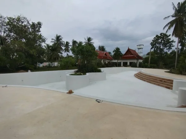Five-Villa Lagoon Pool — the pool before filling