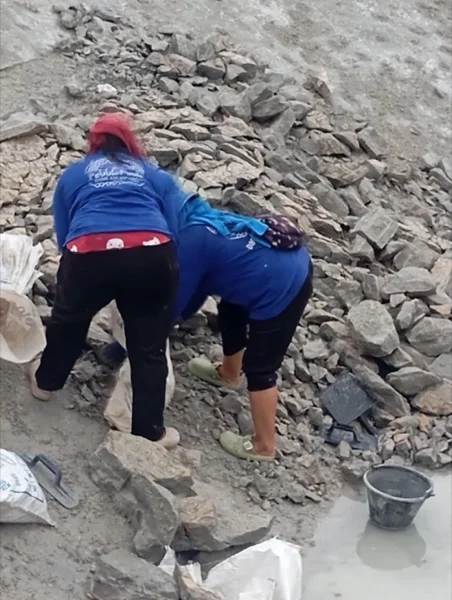 Five-Villa Lagoon Pool — clearing the broken-out material from failed plaster