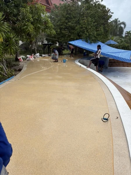 Five-Villa Lagoon Pool — the terrace washed surface around the pool