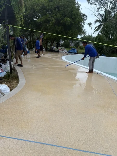 Five-Villa Lagoon Pool — washing the finish to expose the aggregate