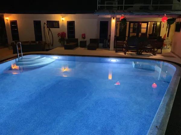 Guesthouse, Kathu — the pool lit at night