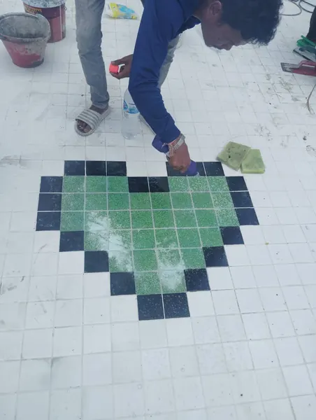 Heart Shape Feature on Pool Floor — cleaning the heart, square by square