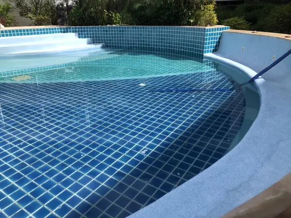 Karon Butterfly Condominium — the pool filled, with the new finish on the benches