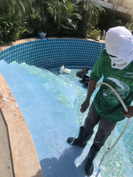Karon Butterfly Condominium — washing the new finish on the steps