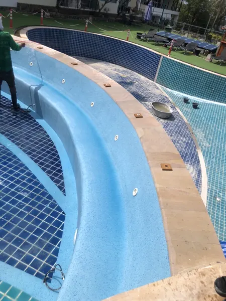 Karon Butterfly Condominium — washing the curved bench