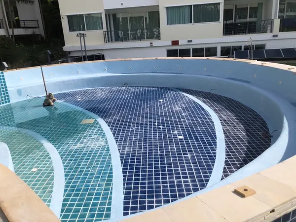 Karon Butterfly Condominium — the washed benches and steps, before filling