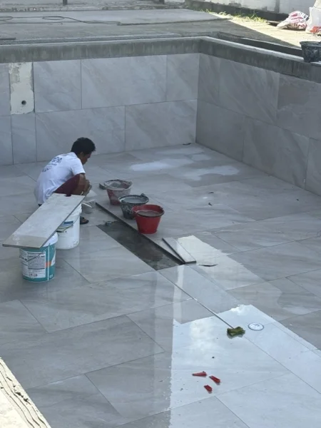 Private Villa, Laguna — tiling the pool wall