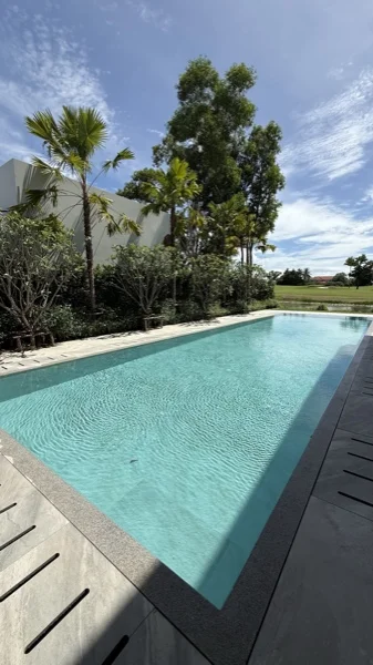Private Villa, Laguna — the pool and the villa from the garden