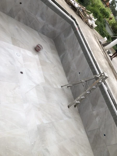 Private Villa, Laguna — tiling carried round the pool corner