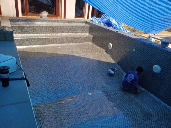 Mai Khao Dream Villa Resort — washing down the finished mosaic