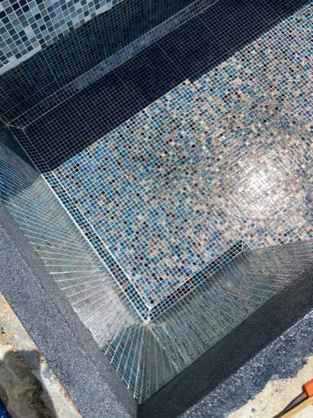 Mai Khao Dream — mosaic meeting the Black Granite coping