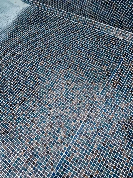 Mai Khao Dream Villa Resort — the mosaics laminated across the pool floor