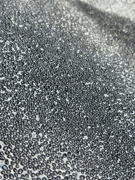 Mai Khao Dream — PebbleCrete Glass Carbon Black, close up