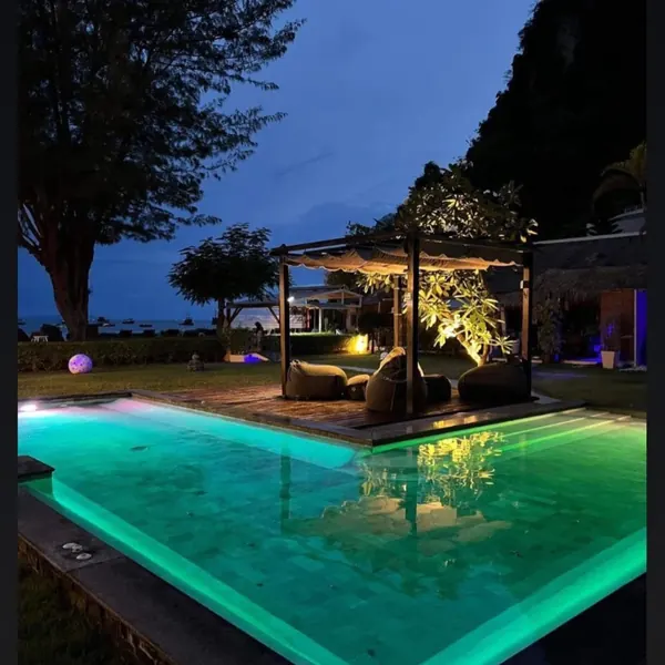 Mama Beach Residence, Phi Phi — the pool lit at dusk