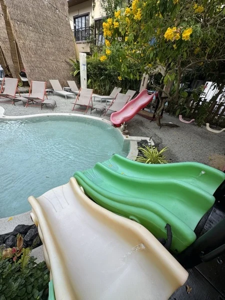 NY Kids — the pool and its green slide