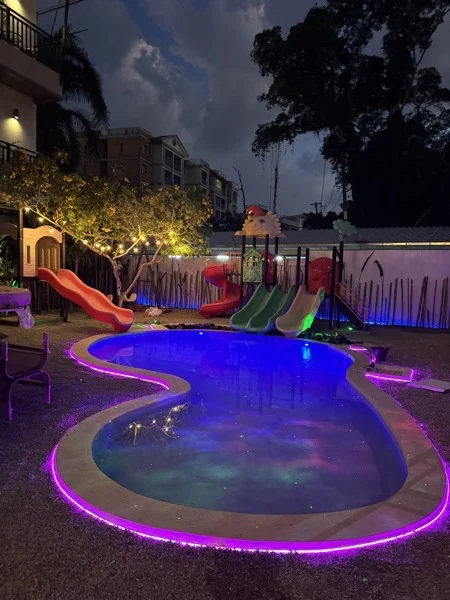 NY Kids — the pool lit at night