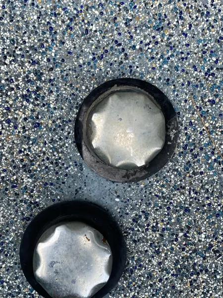 Pearl of Naithon — skimmer lids set into the new coping