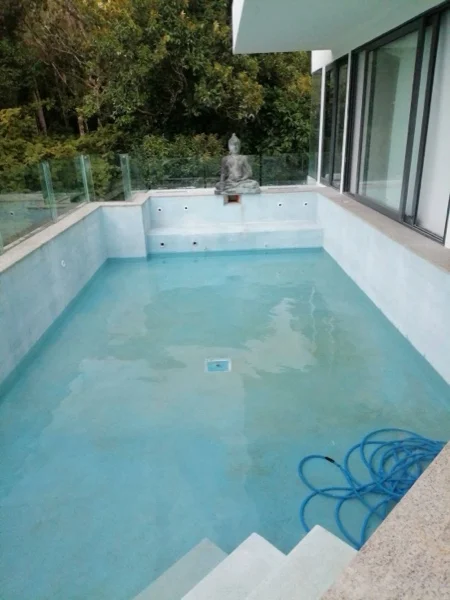 The condo pool during the renovation