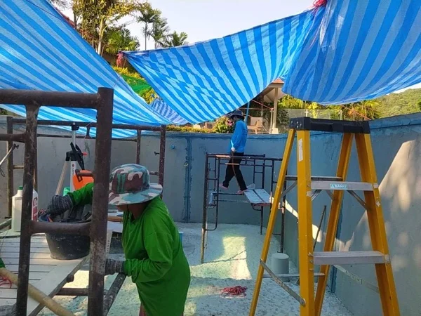 Scaffolding set up inside the pool shell so the walls could be reached